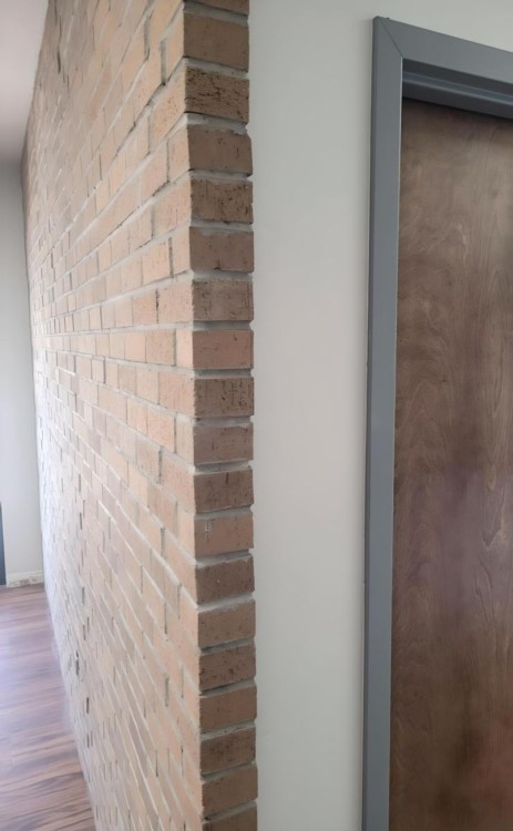 Interior views of brick wall in office building